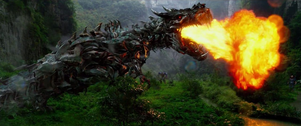 transfomers presente le groupe imagine dragons avec grimlock qui crache du feu
